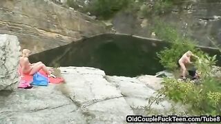 A mother and daughter are getting fucked by a father in an outdoor setting