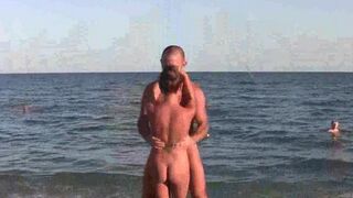 Nude girls are having fun on the beach with acrobatics