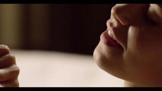 A beautiful woman gently fucks with her lover in the bedroom