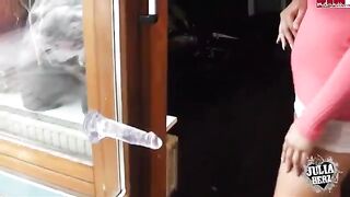 A sexy brunette girl with big tits plays with a dump truck