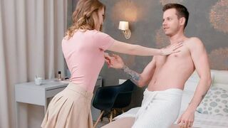 A couple has a conversation while lying on the bed naked