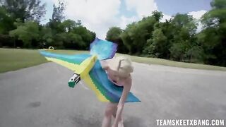 A girl is having fun with nature and a young guy