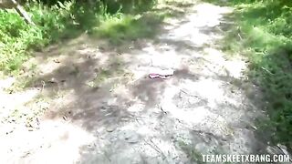 A girl is having fun with nature and a young guy