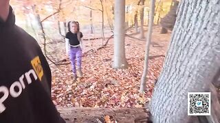 A girl is having fun with someone in the park, just like a scene from a movie