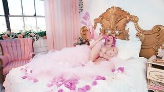 A woman with big boobs is masturbating and showing her boobs