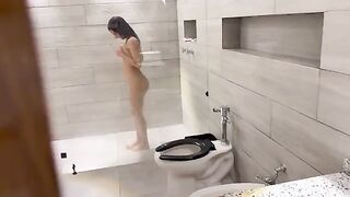 A cute girl has sex with her boyfriend in the shower