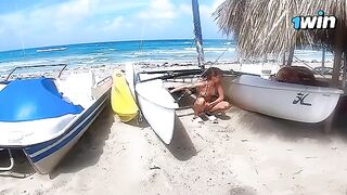 A young cute couple enjoy passionate sex on the beach