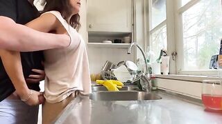 A couple has sex right in the kitchen, with a stunning MILF