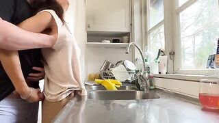A couple has sex right in the kitchen, with a stunning MILF