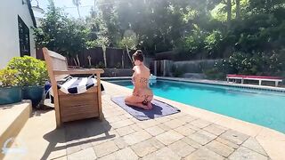 A busty blonde is having fun in the pool with someone