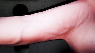 A girl caresses herself with a gentle sex toy, moaning