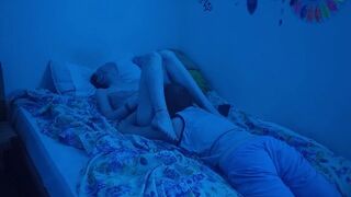 The couple has sex in a bedroom with neon lights
