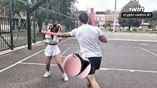 The beautiful girl is having fun with her personal trainer